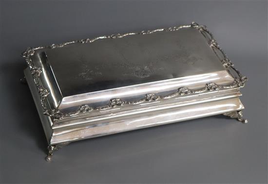 An Edwardian cigarette box, with pierced cast swag border and engraved top, Chester, 1908,